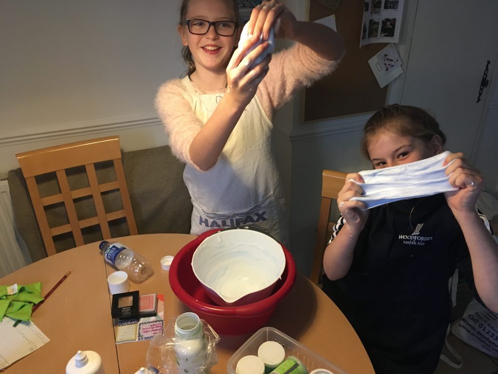 Kids proudly making slime at home with our UK slime recipe without Borax